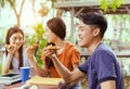 Asian group together eating pizza in breaking time Royalty Free Stock Photo