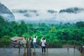 Asian group traveler in raining day VangVieng Royalty Free Stock Photo