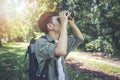 Asian Group of young people Hiking with friends backpacks walking together and using binoculars ,Relax time on holiday concept Royalty Free Stock Photo