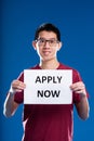 Asian guy asking you to apply now Royalty Free Stock Photo