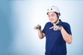 Asian guy gesture biking bicycle, with bicycle helmet and gloves Royalty Free Stock Photo