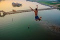 Asian Guy Jump from Mon Bridge in sangkhlaburi kanchanaburithailand