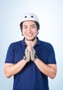 Asian guy welcome Greeting Sawasdee with bicycle helmet and glov Royalty Free Stock Photo