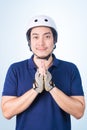 Asian guy welcome Greeting Sawasdee with bicycle helmet and glov Royalty Free Stock Photo