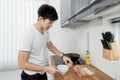 Asian Handsome man cooking in the kitchen at home Royalty Free Stock Photo