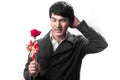 Asian handsome man hold the red rose with love Royalty Free Stock Photo