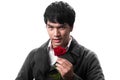 Asian handsome man hold the red rose with love Royalty Free Stock Photo