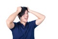 Asian handsome man holding his head frowning with worry. pulling Royalty Free Stock Photo