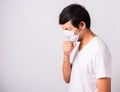 Man wearing surgical hygienic protective cloth face mask against coronavirus he sneeze Royalty Free Stock Photo