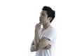 Asian handsome man with white shirt has seriuosly thinking for n Royalty Free Stock Photo