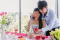 Asian handsome young man proposing and closed his eyes with surprised to girlfriend by wedding diamond ring Royalty Free Stock Photo