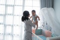 Asian happy baby on the crib Royalty Free Stock Photo