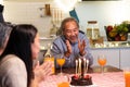 Asian happy big family enjoy spend time together celebrate Birthday party, eat cake and drink on dinner table at home. Loving Gran Royalty Free Stock Photo