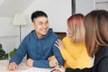 Asian happy couple buying new home with realtor agent with smiling face at new home.buying new house real estate Royalty Free Stock Photo