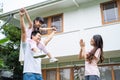 Asian Happy family parents with cute daughter outdoor having fun playing the pilot of an airplane at home. Preschool little kid si