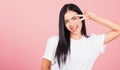 Woman teen smile standing showing finger making v-sign victory Royalty Free Stock Photo
