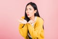 Woman teen standing blowing kiss air something on palm Royalty Free Stock Photo