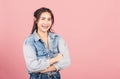 Woman wear denim standing her smile confidence with crossed arms