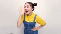 Asian happy portrait beautiful young woman standing smiling profile shouting and holding hand near her open mouth on white Royalty Free Stock Photo