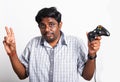 black man funny use hand playing video game pad joystick Royalty Free Stock Photo