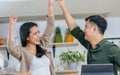 Asian happy young adult couple lover helping together for cooking in cozy home kitchen in morning, preparing meal for breakfast, Royalty Free Stock Photo