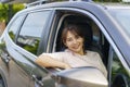 Asian happy young beautiful woman driving a car in front seat with smile prepare to journey with her car Royalty Free Stock Photo