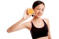 Asian healthy girl on diet with orange fruit Royalty Free Stock Photo