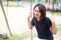 Asian healthy teen wear casual cloth smile sitting play swing