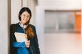 Asian high school girl or college student wearing eyeglasses, smiling in university campus with copy space. Education concept Royalty Free Stock Photo