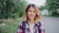 Asian hiker woman trekking in forest. Young happy backpack girl smiling to camera, travel nature and adventure trip, climb