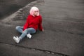 Asian hipster sitting on grungy ground Royalty Free Stock Photo