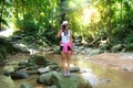 Asian hipster women take a photo of waterfall