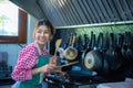Asian home cook woman holding spatula cooking in the kitchen, Healthy Food, Healthy Lifestyle, Seasoning Royalty Free Stock Photo