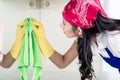 Asian homemaker cleaning the home with cloth