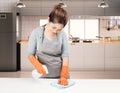 Asian housekeeper cleaning on table Royalty Free Stock Photo