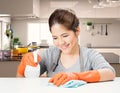 Asian housekeeper cleaning on table Royalty Free Stock Photo