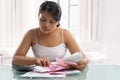 Asian housewife checking all the bills Royalty Free Stock Photo