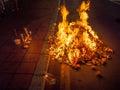 Asian Hungry Ghost day, paper money burning at bone fire, Buddhist and Taoist festival