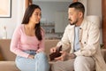 Asian Husband Showing Wallet To Wife Experiencing Finance Hardship Indoor Royalty Free Stock Photo