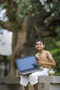 Asian Indian boy showing laptop screen Royalty Free Stock Photo