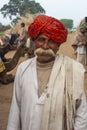 Asian Indian Man with Red Turban and Luxurious Mustache in Village