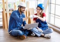 Asian Indian professional bearded male female engineer architect foreman labor worker colleague wear safety goggles hard helmet Royalty Free Stock Photo