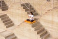 Asian Woman doing outdoor yoga tree pose meditation exercise, mental peace Fitness and health concept