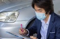 Asian Insurance Agent or Insurance Agency Wear Mask Write Car Crash Report in Zoom View