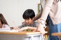 Asian Japanese boy writing at desk Royalty Free Stock Photo