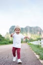 Asian Japanese child boy running at outdoor