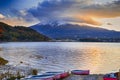 Asian Japanese Destinations. Kawaguchiko Lake in Front of Picturesque Fuji Mountain with Line of Boats in Foreground in Japan