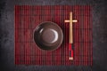 Asian Japanese table setting. Bamboo chopsticks and bowl on striped mat Royalty Free Stock Photo