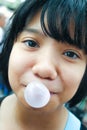 Asian kid blowing a bubble gum Royalty Free Stock Photo