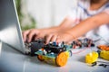 Asian kid boy learns coding and programming with laptop for Arduino robot car Royalty Free Stock Photo